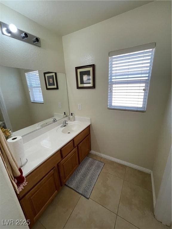 5625 Fast Payout Ct, Las Vegas, NV 89122 - bathroom featuring vanity, plenty of natural light, and tile patterned flooring