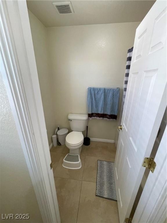 5625 Fast Payout Ct, Las Vegas, NV 89122 - bathroom featuring toilet and tile patterned flooring