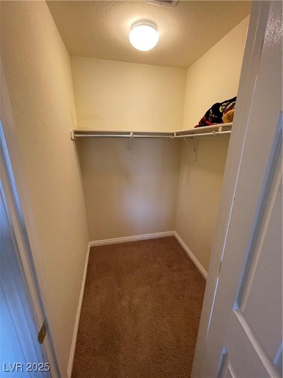 5625 Fast Payout Ct, Las Vegas, NV 89122 - spacious closet featuring carpet floors