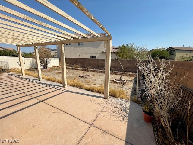 5625 Fast Payout Ct, Las Vegas, NV 89122 - fenced backyard featuring a patio, a fire pit, and a pergola