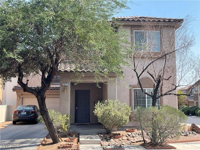 5625 Fast Payout Ct, Las Vegas, NV 89122 - view of front of property with a tiled roof, a garage, driveway, and stucco siding