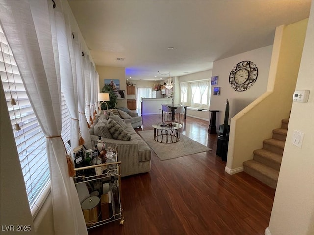 5625 Fast Payout Ct, Las Vegas, NV 89122 - living room featuring wood finished floors and stairs