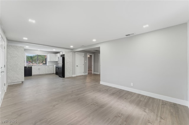 2222 N Martin L King Blvd, Las Vegas, NV 89106 - unfurnished living room with recessed lighting and light wood-type flooring