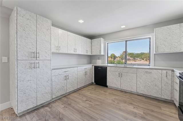 2222 N Martin L King Blvd, Las Vegas, NV 89106 - kitchen featuring light wood-style floors, dishwasher, and light countertops