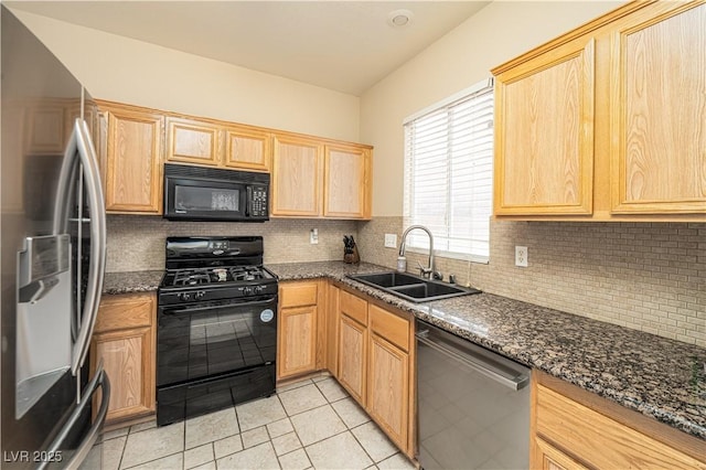 1453 Evening Song Ave, Henderson, NV 89012 - kitchen featuring black appliances, light brown cabinetry, decorative backsplash, light tile patterned flooring, and dark stone countertops