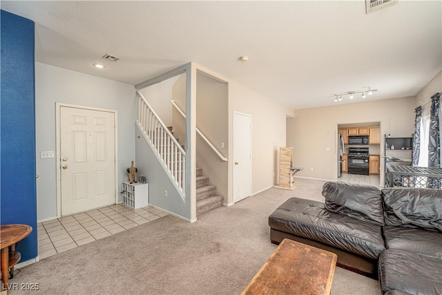 1453 Evening Song Ave, Henderson, NV 89012 - living area with stairway, light carpet, and light tile patterned flooring
