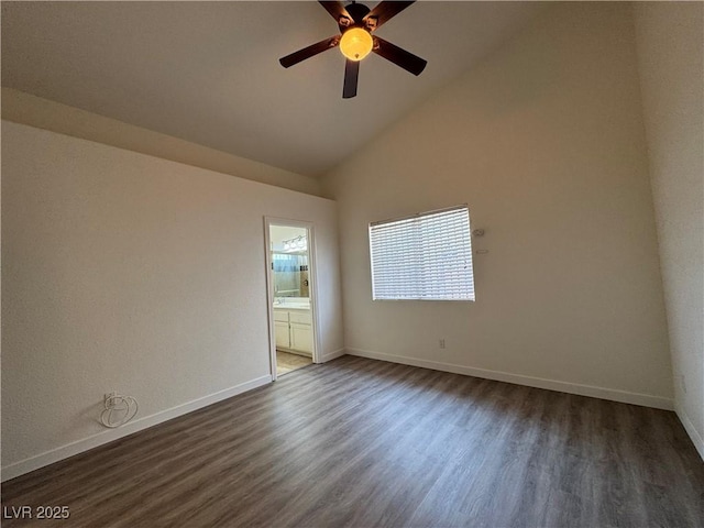 2503 River Oaks Dr, Las Vegas, NV 89156 - spare room with dark wood-style flooring, a ceiling fan, and high vaulted ceiling