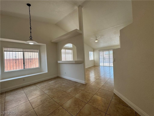 2503 River Oaks Dr, Las Vegas, NV 89156 - tiled spare room featuring plenty of natural light, vaulted ceiling, and a ceiling fan