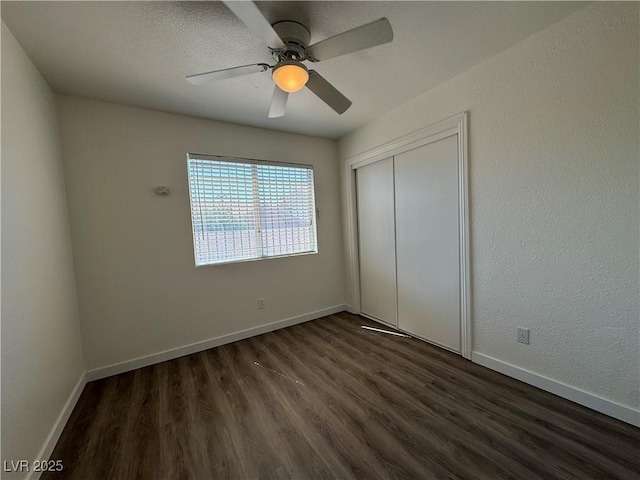 2503 River Oaks Dr, Las Vegas, NV 89156 - unfurnished bedroom with dark wood-style floors, a closet, and ceiling fan