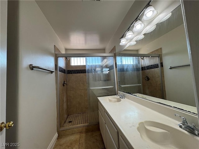 2503 River Oaks Dr, Las Vegas, NV 89156 - full bath featuring a stall shower, double vanity, and tile patterned floors