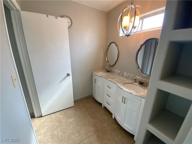 5753 E Monroe Ave, Las Vegas, NV 89110 - full bath featuring a chandelier, double vanity, and tile patterned flooring