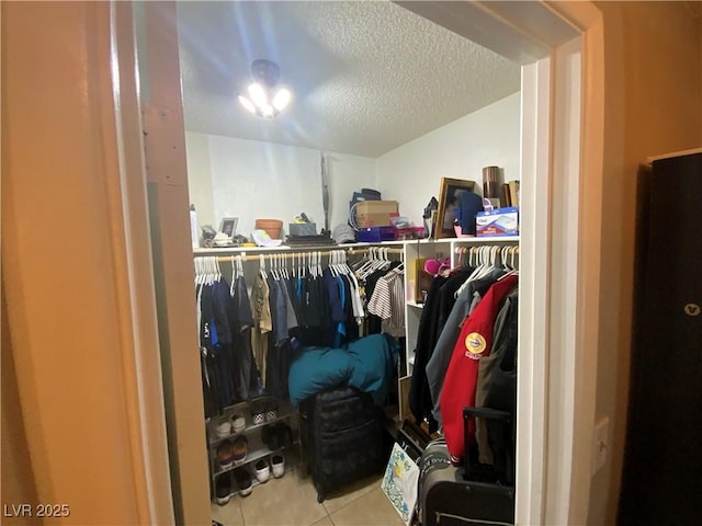 5753 E Monroe Ave, Las Vegas, NV 89110 - walk in closet featuring tile patterned floors