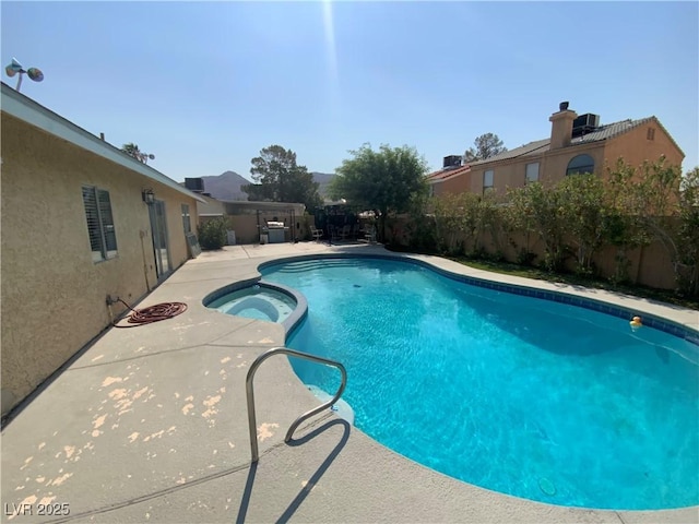 5753 E Monroe Ave, Las Vegas, NV 89110 - view of pool with a pool with connected hot tub, a fenced backyard, and a patio