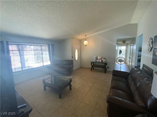 5753 E Monroe Ave, Las Vegas, NV 89110 - tiled living area featuring a textured ceiling