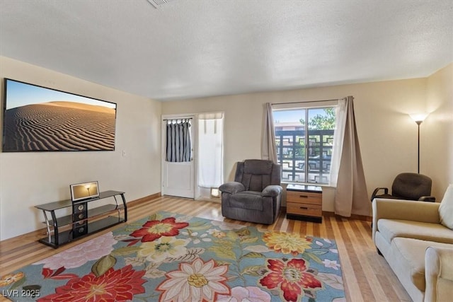 1481 Lorilyn Ave Unit 1, Las Vegas, NV 89119 - living room featuring wood finished floors and a textured ceiling