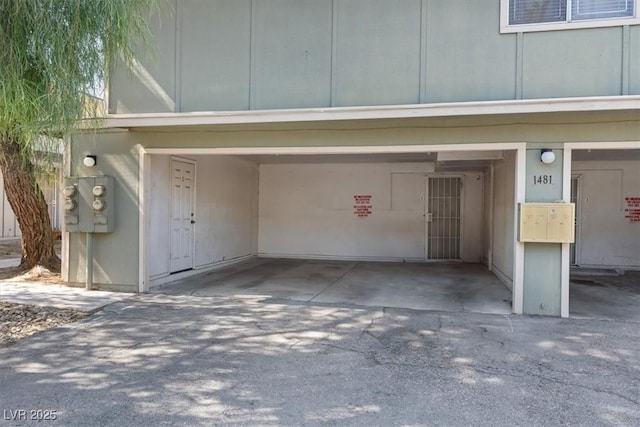1481 Lorilyn Ave Unit 1, Las Vegas, NV 89119 - garage featuring driveway and a carport