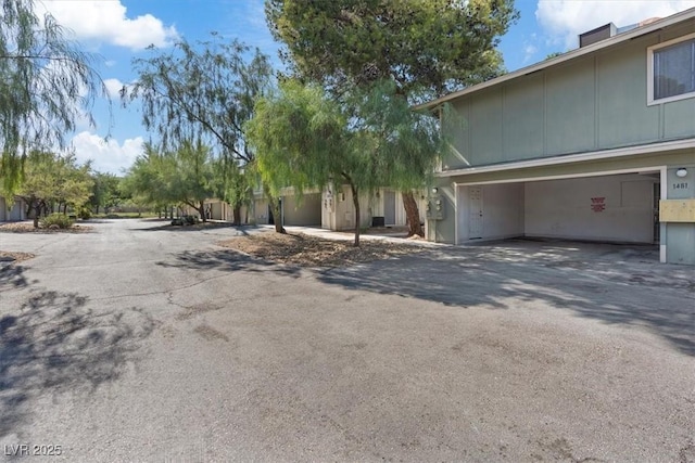 1481 Lorilyn Ave Unit 1, Las Vegas, NV 89119 - view of side of home with driveway and an attached garage