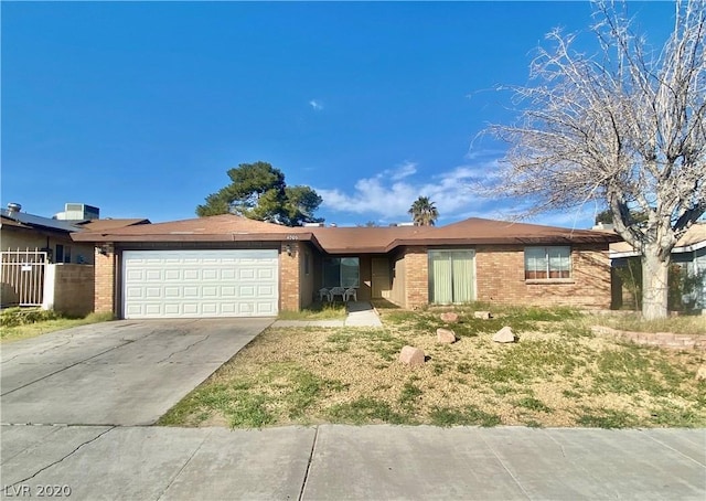 ranch-style home featuring a garage