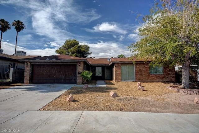 ranch-style house featuring a garage