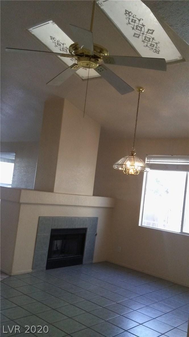 6520 Lombard Dr, Las Vegas, NV 89108 - interior space with tile flooring, a tile fireplace, and ceiling fan
