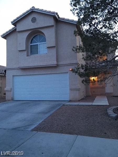 view of front of property with a garage