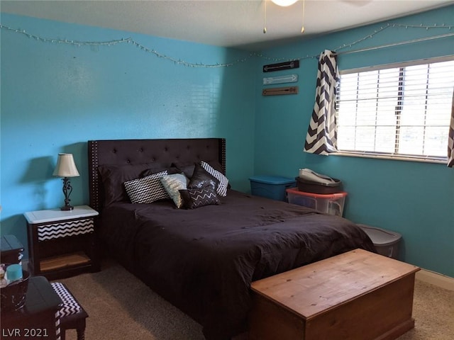 carpeted bedroom with ceiling fan