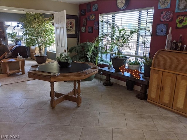 interior space with plenty of natural light and light tile flooring