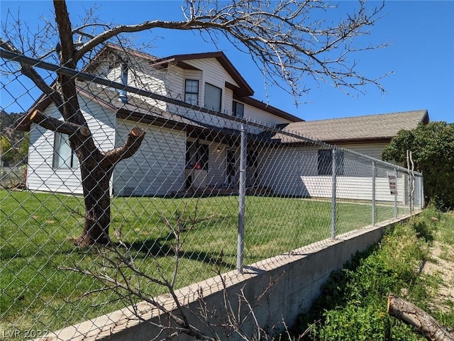 view of side of property with a yard