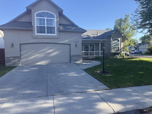 11349 W Marlinwood St, Boise, ID 83713 - view of front of property featuring brick siding, a front yard, driveway, and a garage