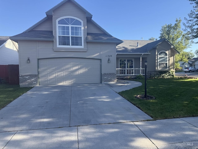 11349 W Marlinwood St, Boise, ID 83713 - traditional-style home featuring brick siding, a front lawn, driveway, and an attached garage