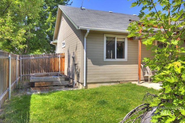 11349 W Marlinwood St, Boise, ID 83713 - view of side of home featuring a fenced backyard and roof with shingles