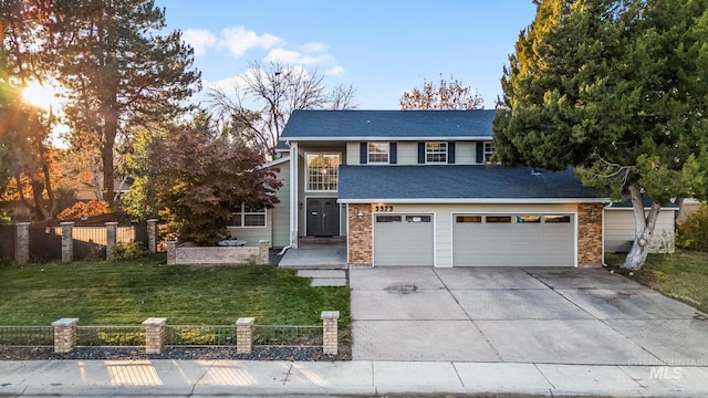 view of front of home with a garage and a front lawn