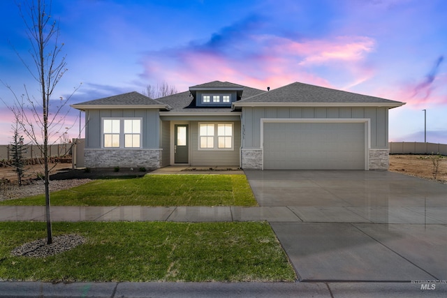 1351 E Andes Dr, Kuna, ID 83634 - prairie-style house with stone siding, an attached garage, a shingled roof, board and batten siding, and concrete driveway