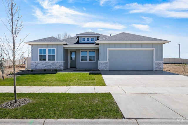 1351 E Andes Dr, Kuna, ID 83634 - prairie-style home featuring stone siding, board and batten siding, and a garage