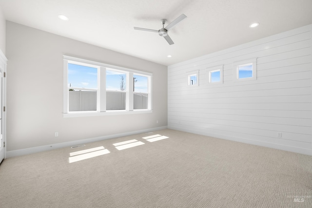 1351 E Andes Dr, Kuna, ID 83634 - carpeted empty room featuring a ceiling fan, wooden walls, recessed lighting, and baseboards