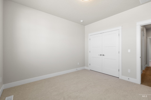 1351 E Andes Dr, Kuna, ID 83634 - unfurnished bedroom with carpet, baseboards, and a closet