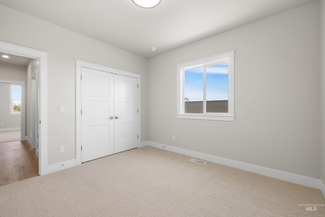 1351 E Andes Dr, Kuna, ID 83634 - unfurnished bedroom with baseboards, carpet floors, and a closet