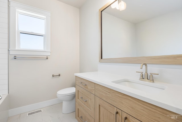 1351 E Andes Dr, Kuna, ID 83634 - bathroom with vanity, marble finish flooring, baseboards, toilet, and  shower combination