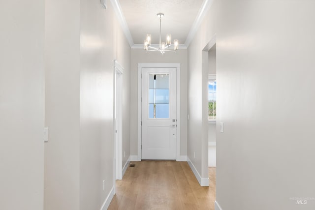 1351 E Andes Dr, Kuna, ID 83634 - doorway featuring a chandelier, light wood-style flooring, ornamental molding, and baseboards