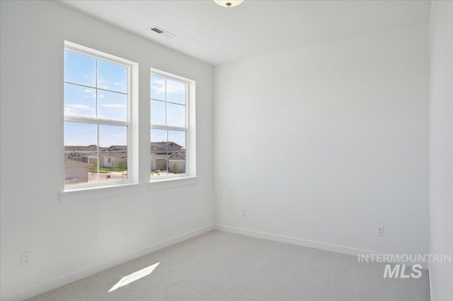 5509 N Patimos Ave, Meridian, ID 83646 - spare room with baseboards, visible vents, and light carpet