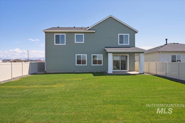 5509 N Patimos Ave, Meridian, ID 83646 - back of house featuring a lawn and a fenced backyard