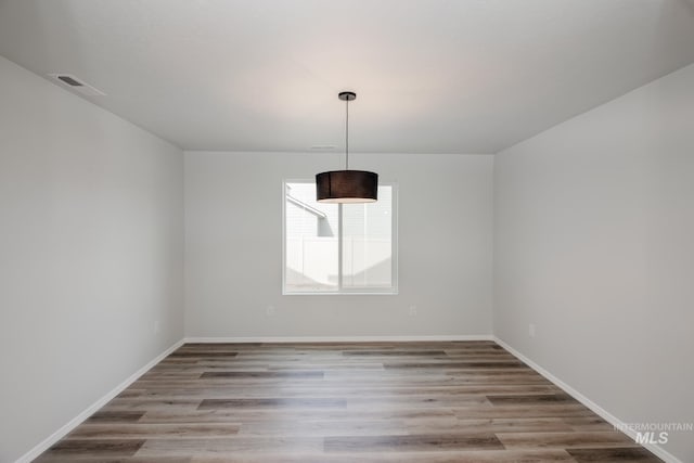 spare room with light wood-type flooring