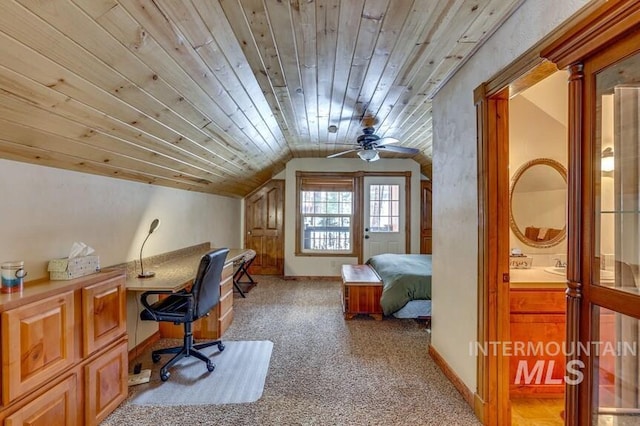 bedroom featuring light colored carpet, wood ceiling, vaulted ceiling, and baseboards