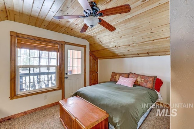 bedroom featuring wooden ceiling, baseboards, carpet flooring, ceiling fan, and vaulted ceiling
