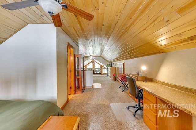 interior space with vaulted ceiling, ceiling fan, and wooden ceiling
