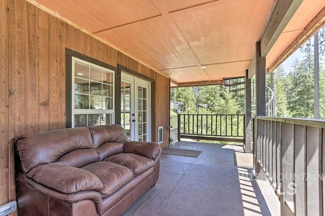 balcony with a porch and french doors