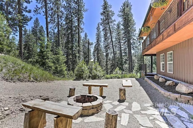 view of patio / terrace with a fire pit