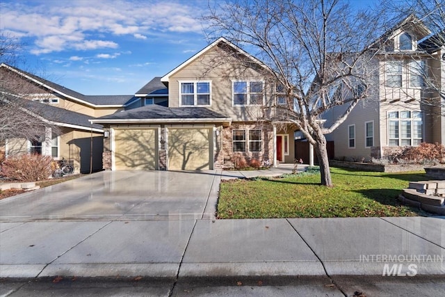 front of property with a front yard and a garage