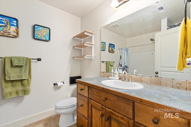 bathroom featuring tile patterned floors, vanity, toilet, and a shower with curtain