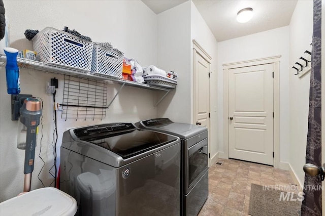 washroom featuring independent washer and dryer